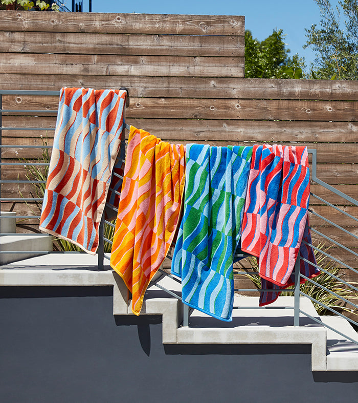 Beach towels hanging on a clothing line
